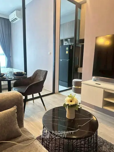 Stylish modern living room with open kitchen and elegant decor