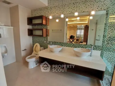 Luxurious modern bathroom with dual sinks and stylish mosaic tiles