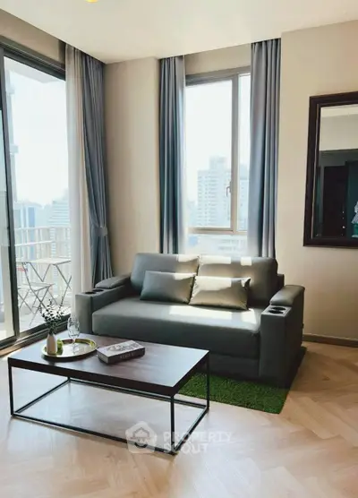 Modern living room with city view, cozy sofa, and stylish decor.