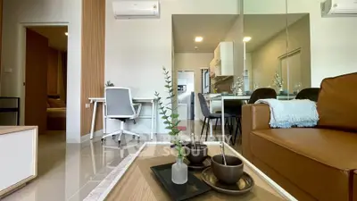 Modern living room with open kitchen and stylish decor