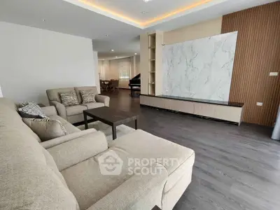 Spacious modern living room with elegant decor and ample natural light