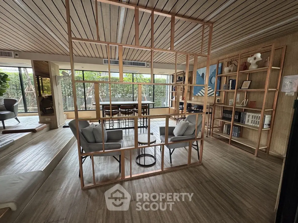 Spacious modern living room with stylish wooden partition and large windows