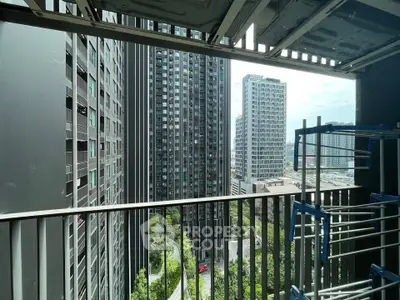 Modern urban balcony view with high-rise buildings and cityscape