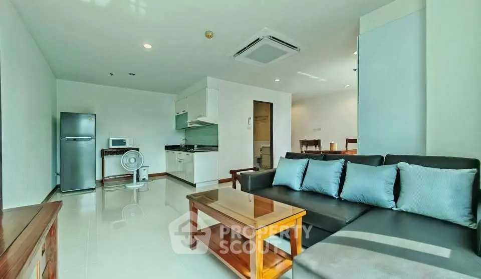 Spacious modern living room with open kitchen and stylish furniture