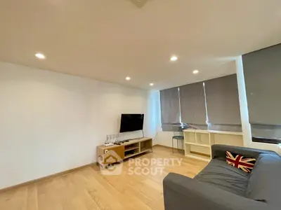 Spacious living room with modern decor and natural light