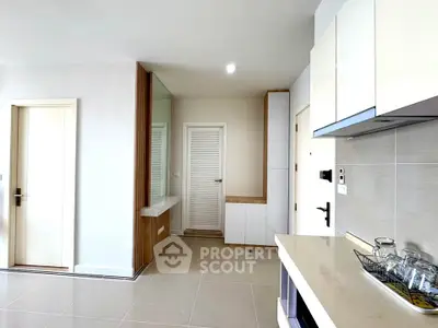 Modern kitchen with sleek cabinets and open layout in bright apartment