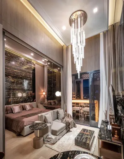 Luxurious bedroom with elegant chandelier and stunning balcony view