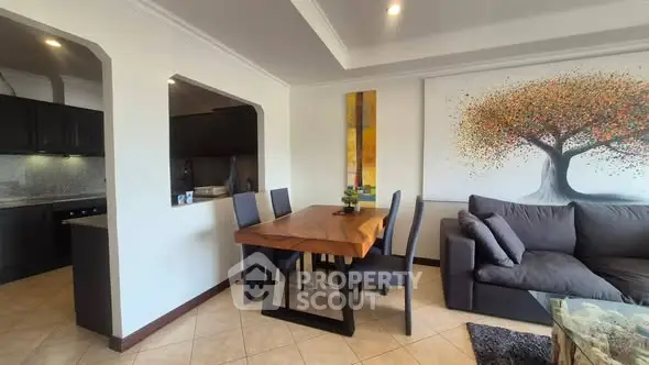 Modern living room with stylish dining area and open kitchen layout