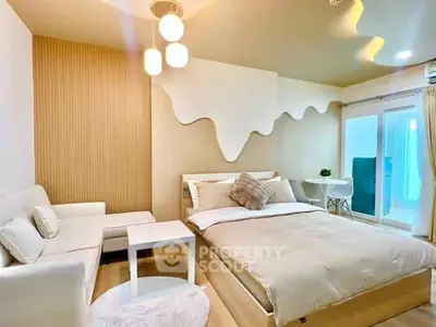 Modern bedroom with stylish decor and cozy seating area, perfect for relaxation and comfort.