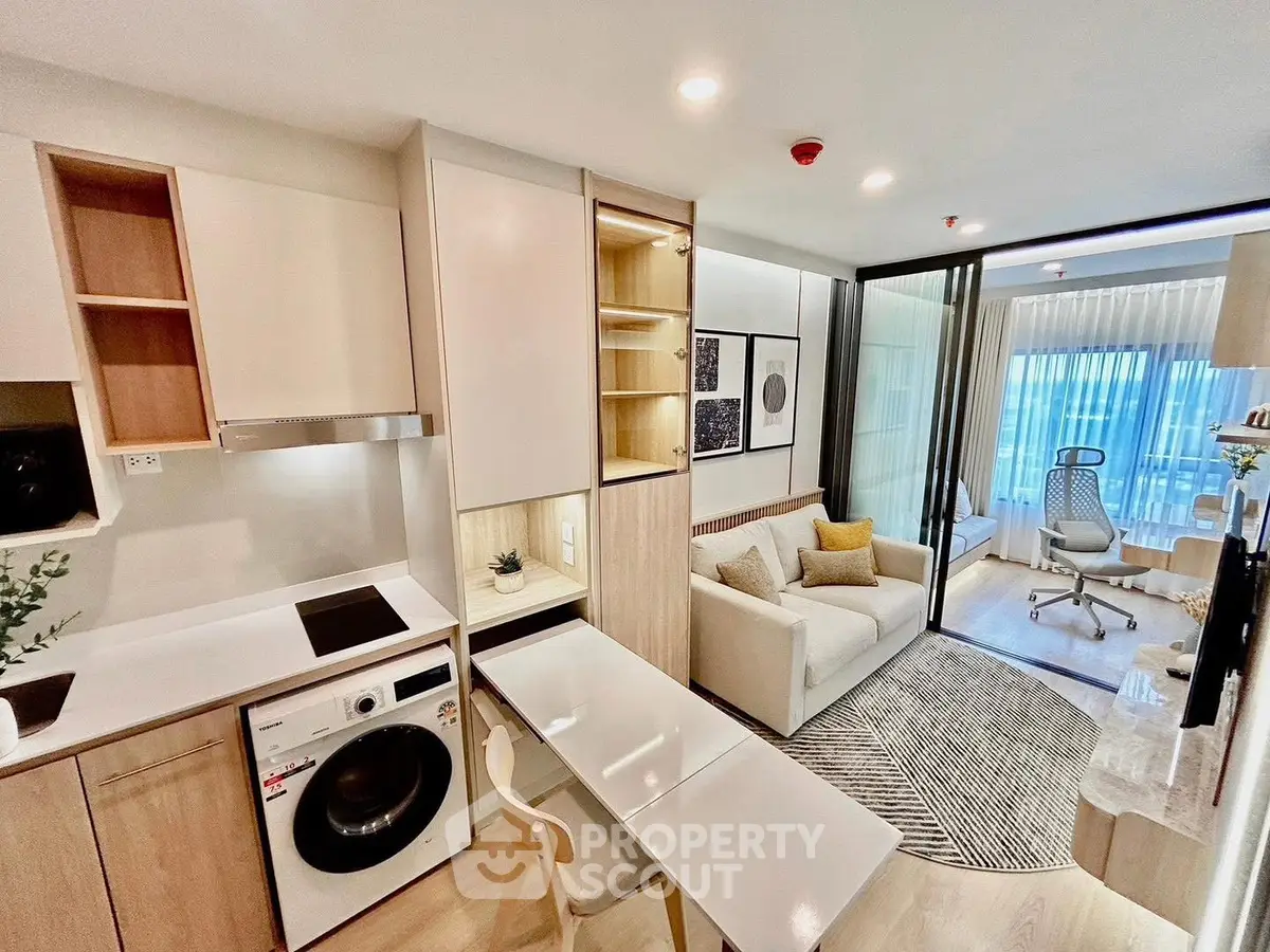 Modern open-plan living room with integrated kitchen and stylish decor