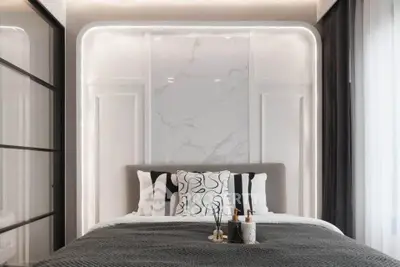 Luxurious modern bedroom with elegant marble accent wall and stylish decor
