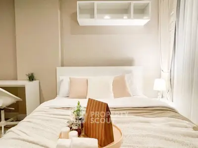Cozy and inviting bedroom with modern decor and soft lighting, perfect for relaxation.