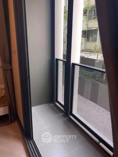 Modern apartment balcony with sleek design and urban view