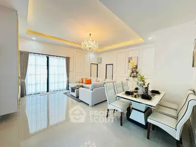 Luxurious living room with elegant dining area and chandelier lighting