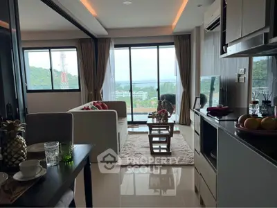 Modern living room with stunning view and open layout, featuring stylish decor and natural light.