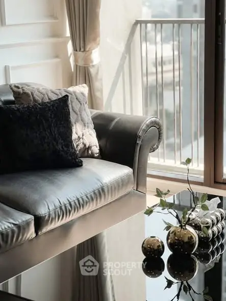 Luxurious living room with elegant sofa and city view balcony, perfect for urban living.