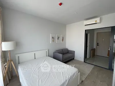 Modern bedroom with minimalist decor and natural light