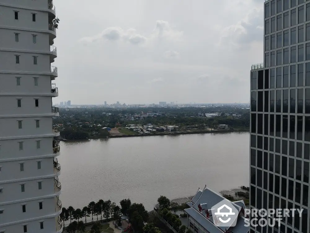 Stunning river view from high-rise building balcony, perfect for urban living enthusiasts.