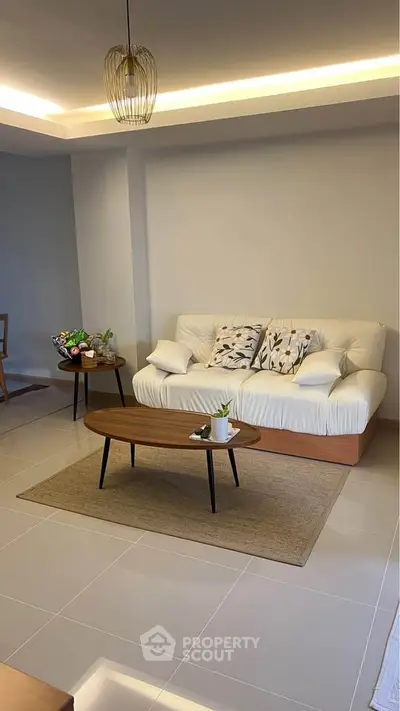 Modern living room with cozy white sofa and stylish coffee table