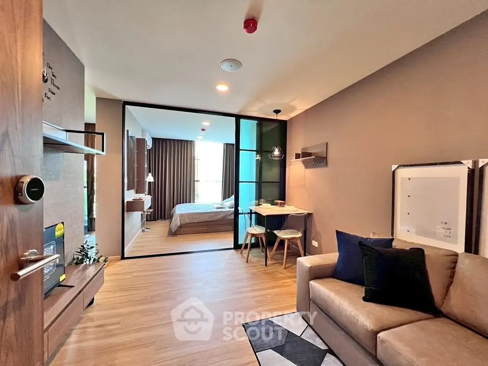 Modern open-plan living room with cozy seating and stylish decor