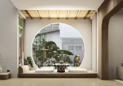 Elegant modern living room with large circular window and minimalist decor