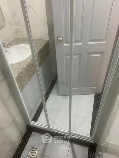 Compact bathroom with shower and modern fixtures