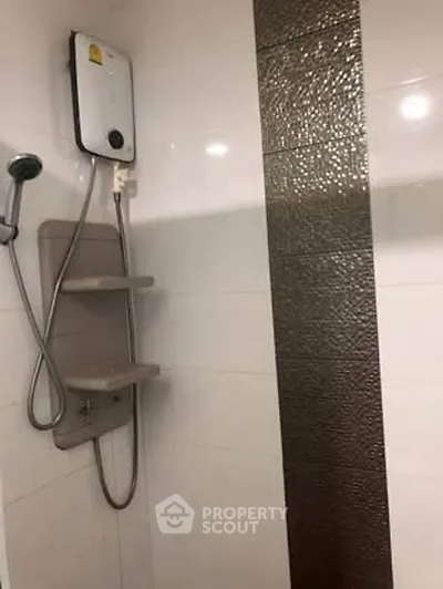 Modern bathroom with sleek shower and elegant tile design