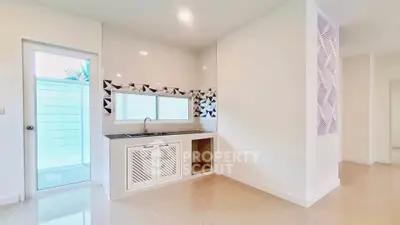 Modern minimalist kitchen with sleek design and geometric backsplash