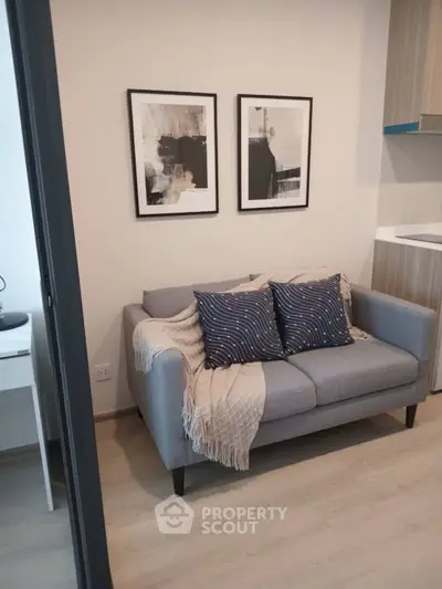 Cozy modern living room with stylish decor and compact sofa