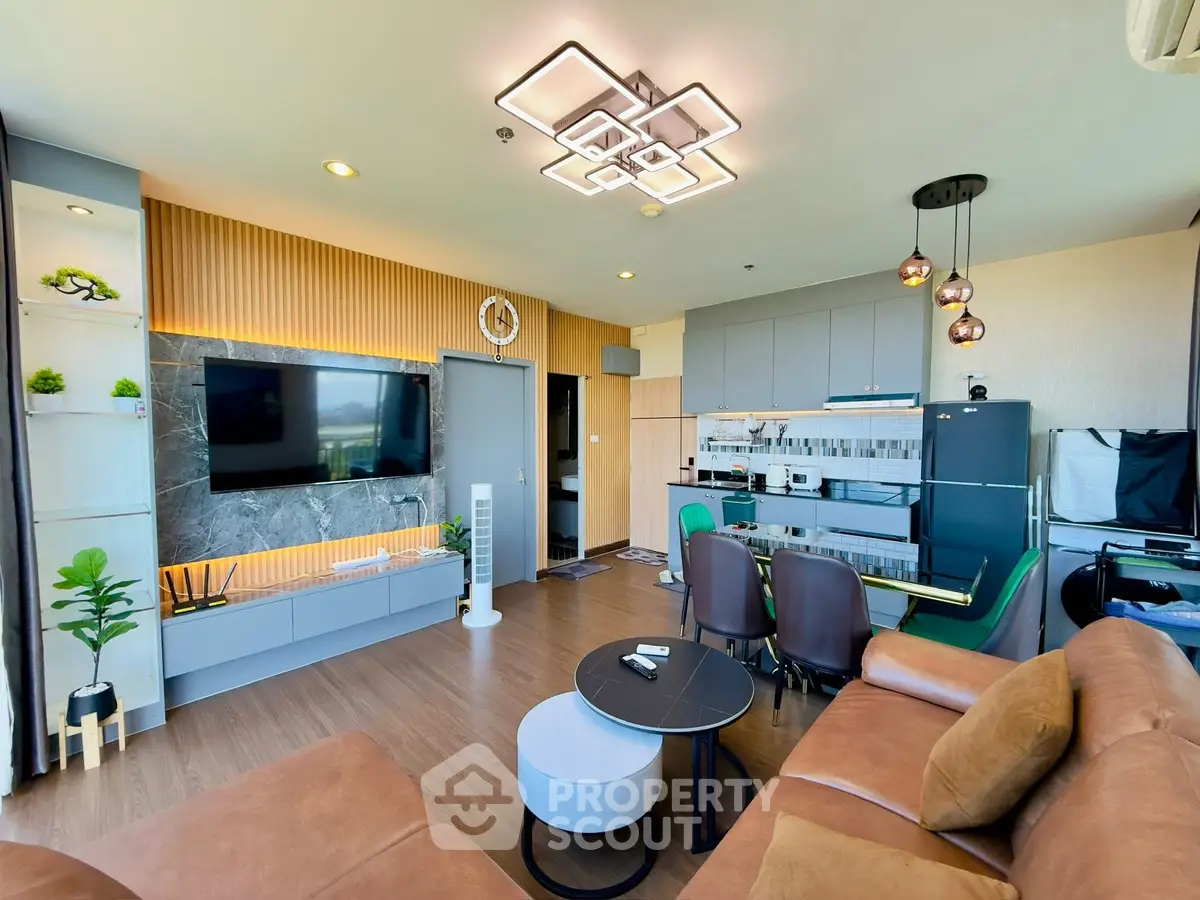 Modern living room with stylish decor and open kitchen layout