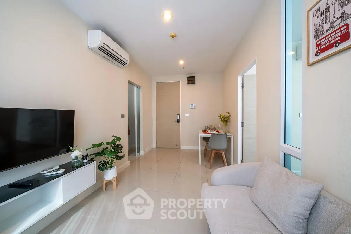 Modern living room with sleek furniture and air conditioning in a cozy apartment.