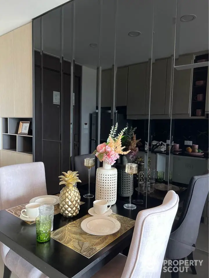 Stylish dining area with elegant table setting and modern decor in a contemporary apartment.