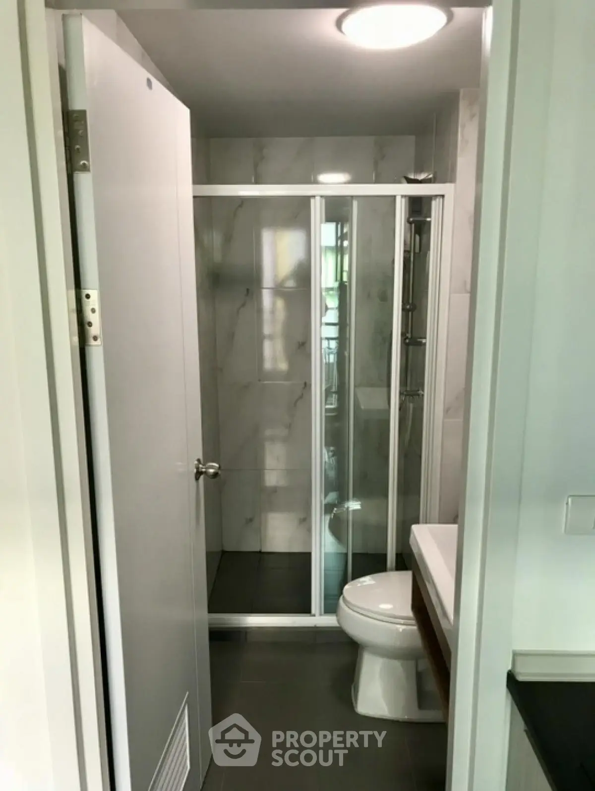 Modern bathroom with glass shower enclosure and sleek design