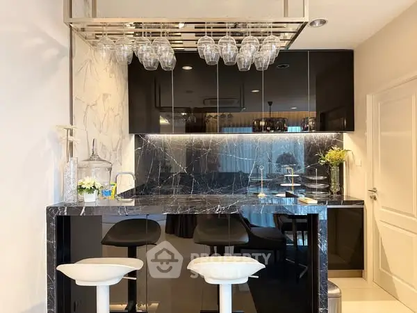 Luxurious modern kitchen with marble countertops and stylish bar seating