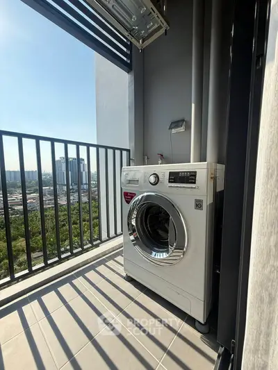 Modern balcony with washing machine and city view, perfect for urban living convenience.