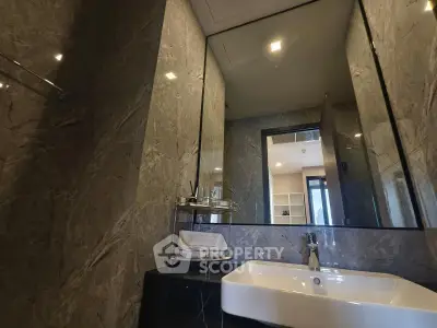 Luxurious marble bathroom with modern sink and mirror