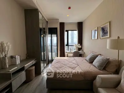 Modern bedroom with city view and stylish decor, featuring a cozy bed and elegant furnishings.