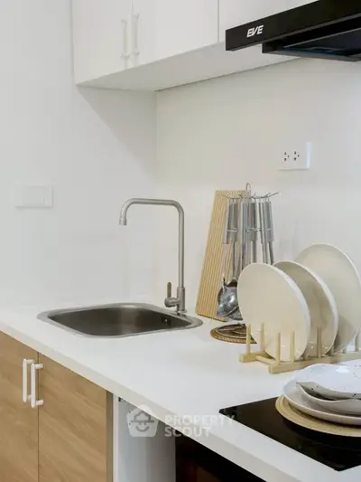 Modern kitchen with sleek design and stainless steel sink