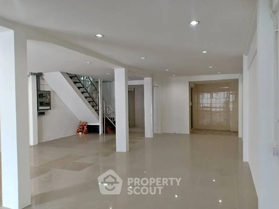 Spacious modern building entrance with sleek design and polished floors