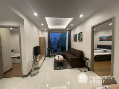 Modern living room with city view, stylish decor, and cozy ambiance