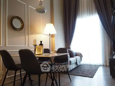 Elegant living room with modern dining set and cozy sofa near large window