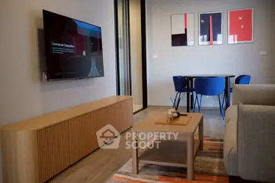 Modern living room with sleek furniture and wall-mounted TV