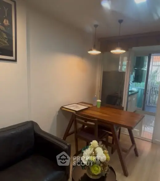 Cozy living area with wooden dining table and modern lighting