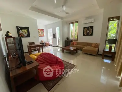 Spacious living room with modern decor and natural light