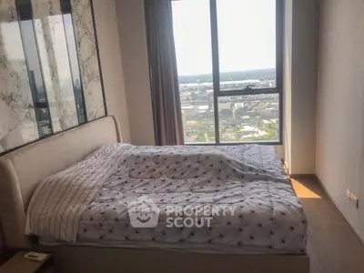 Modern bedroom with stunning city view and elegant decor