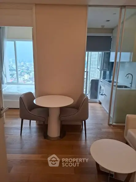 Modern apartment interior with cozy dining area and city view