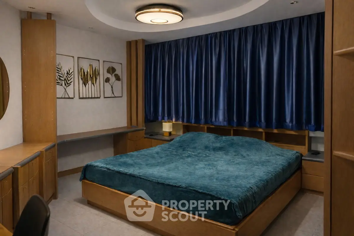 Cozy bedroom with modern decor and blue accents