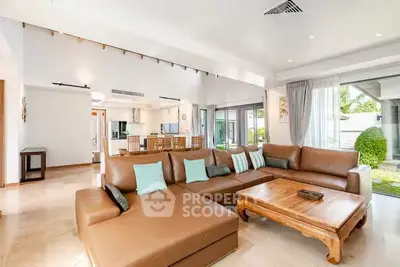 Spacious living room with modern open layout and garden view