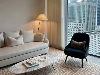 Luxurious living room with city view, elegant furniture, and modern decor.