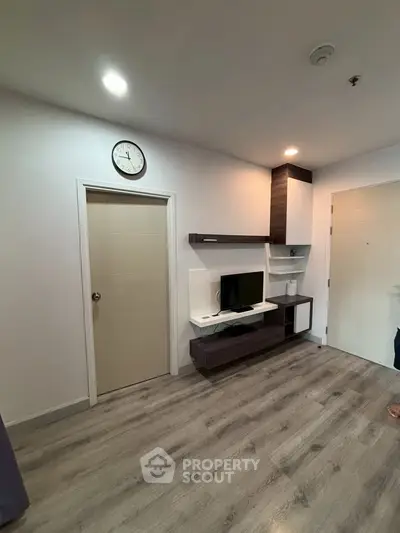 Modern living room with sleek TV unit and stylish flooring